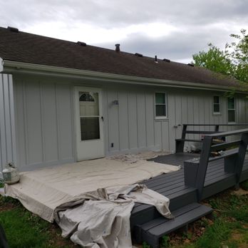 Back of house with fresh exterior paint and deck in progress