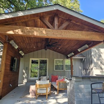 Covered patio with stained wood ceiling