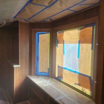 Windows masked and surfaces protected during prep