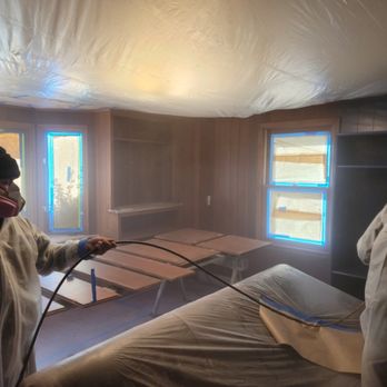 J&W crew spray-finishing an interior in protective suits